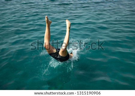 A man jumps into the water
