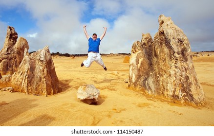 Man Jumps In Pinnacles Desert, Australia