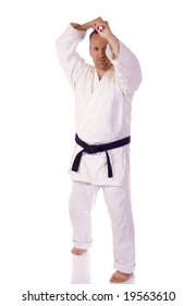 Man In Karate-gi Holding A Bo Staff