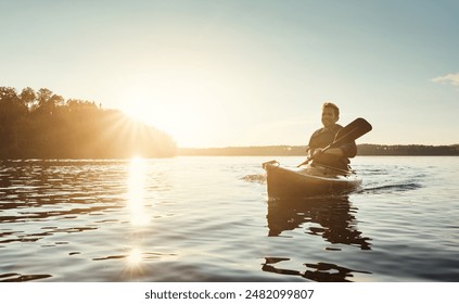 Man, kayak and boat on river trip for sports adventure or outdoor nature travel. Guy, paddling and sunrise workout for morning relaxation, rowing and fitness on lake or water on holiday or vacation - Powered by Shutterstock