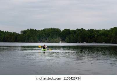 Man In A Kayak On A Lake