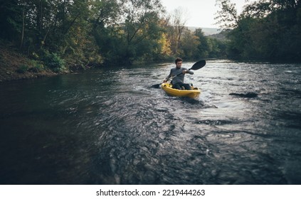 Man In Kayak On River Rapids Ride