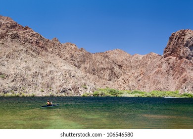 A Man Kayaking In Lake Mead