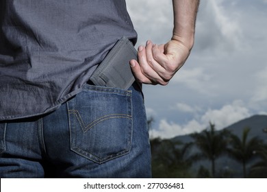 Man Keeping Your Wallet In The Back Pocket Of His Blue Jean Sky Background