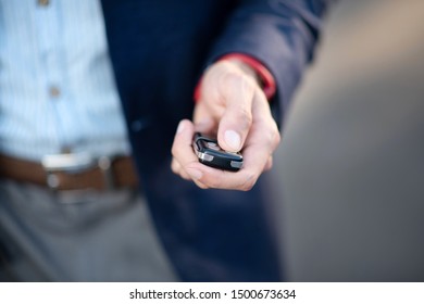 Man With Keys. Close Up Of Businessman Wearing Jacket Holding Car Keys While Running Late For Work