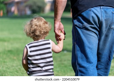 Man Kidnapping Little Toddler Or Boy Walking Holding Hands With His Grandpa At Park