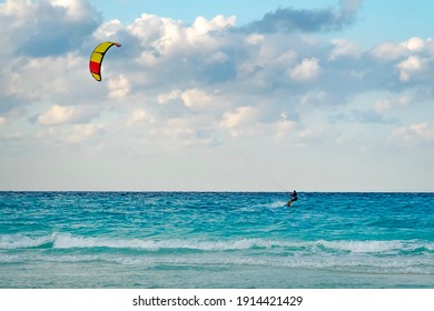 man is kitesurfing in the Caribbean sea in Varadero Cuba.