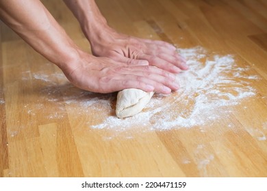 Man Kneading Dough For Baking