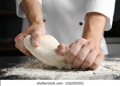 Man kneading dough for pastry on table - Powered by Shutterstock