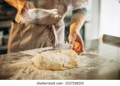 Man kneads the dough for bread - Powered by Shutterstock