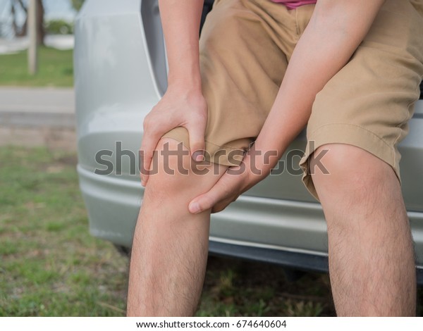 man with knee pain and\
feeling bad.