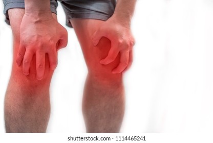 Man With Knee Pain On Both Sides