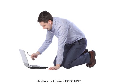 Man Kneeling In Front Of A Laptop Isolated On White Background