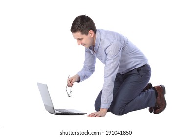 Man Kneeling In Front Of A Laptop Isolated On White Background