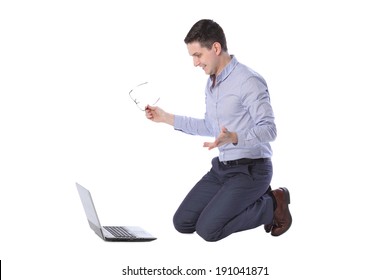 Man Kneeling In Front Of A Laptop Isolated On White Background