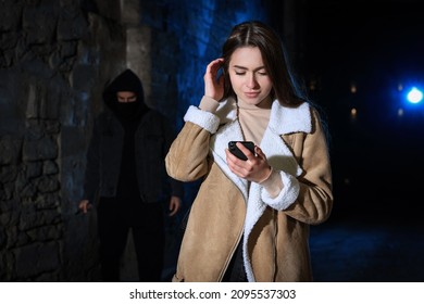 Man with knife stalking young woman in alley at night