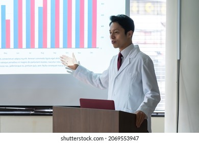 A man in a lab coat giving a speech - Powered by Shutterstock