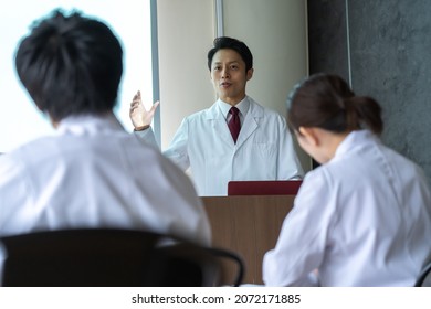 A man in a lab coat giving a speech - Powered by Shutterstock