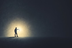 Man With Lamp Walking Illuminating His Path