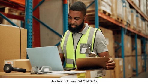 Man, laptop and checklist for inventory in warehouse, technology and research for logistics solutions. African worker, computer and stock taking for ecommerce and online order in distribution center - Powered by Shutterstock