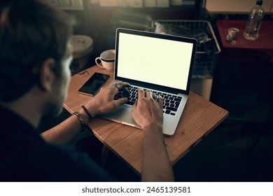 Man, laptop and screen with typing at night for research, working on table startup business. Male entrepreneur, computer and internet for web design in dark cafe for career, creative for branding - Powered by Shutterstock