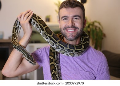 Man With Large Burmese Python At Home