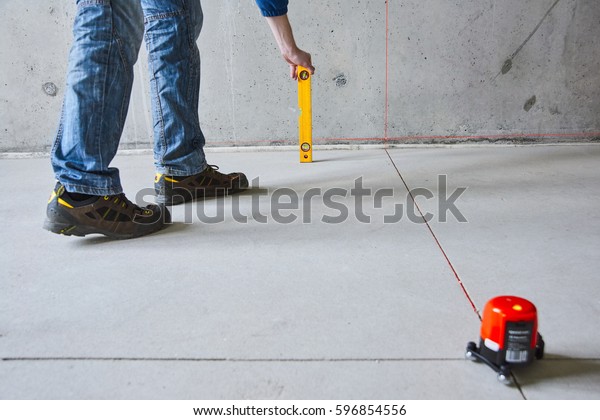 man-laser-level-check-floor-walls-stock-photo-edit-now-596854556