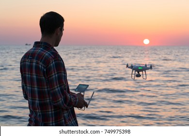 Man Launches A Drone On The Beach