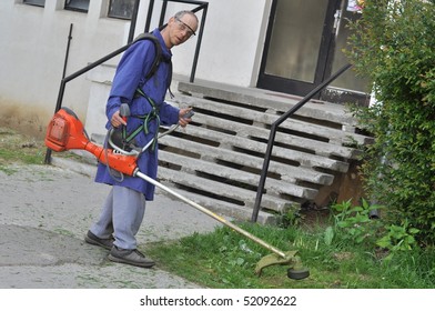   man with lawn mower - Shutterstock ID 52092622
