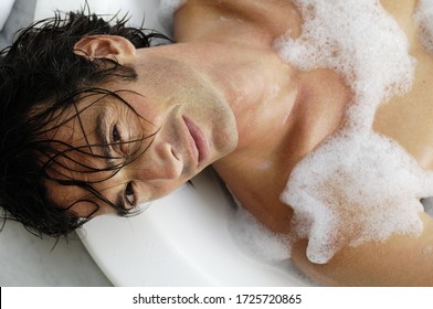 Man Laying In Bubble Bath