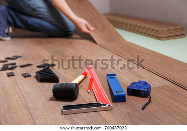 Man Laying Laminate Flooring On Floor Stock Photo Edit Now