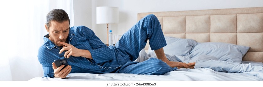 A man laying on a bed, engaged in a phone call. - Powered by Shutterstock