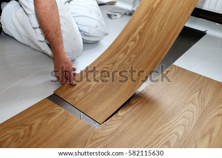 Man laying PVC-floor