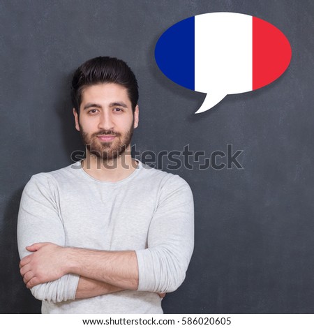 Man learn speaking french in bubble on chalkboard