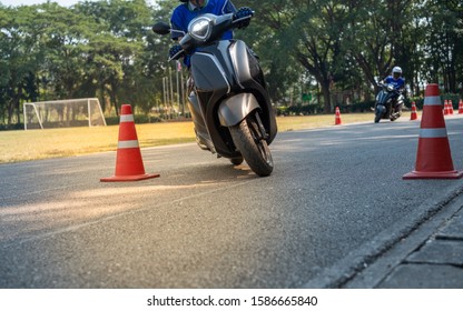 Man is learning to ride a bike . Biker beginner on a motorcycle. - Shutterstock ID 1586665840