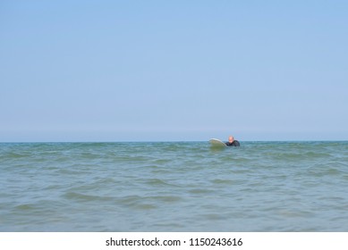 a man learns to surf