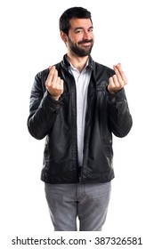 Man With Leather Jacket Doing A Money Gesture