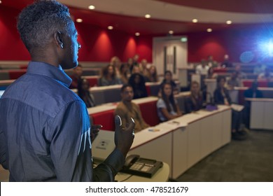 Man Lecturing Students In A University Lecture Theatre