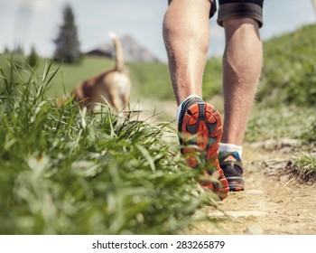 Man legs on the mountain footpath close up image
