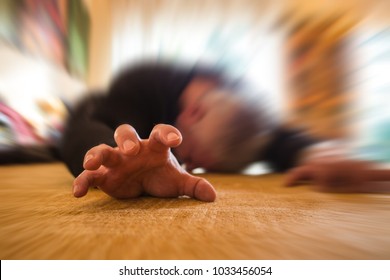 a man lies unconscious in his apartment - Shutterstock ID 1033456054
