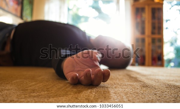 a man lies\
unconscious in his apartment