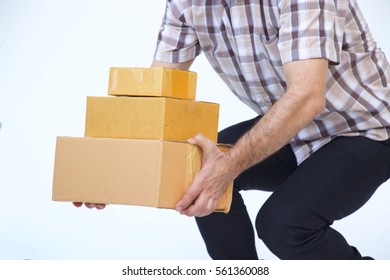 Man Is Lifting Up Three Boxes On White Background.