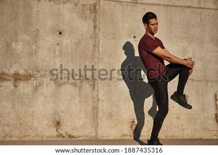 Similar – Happy man and jumping outdoors, warmup before jogging