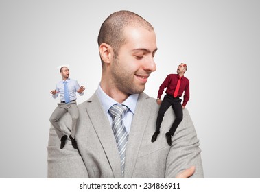 Man listening to the angel and devil self to make a choice - Powered by Shutterstock