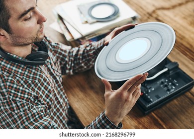 Man Listening To Music From Vinyl Record. Playing Music From Analog Disk On Turntable Player. Enjoying Music From Old Collection. Relaxing At Home. Retro And Vintage. Music Passion