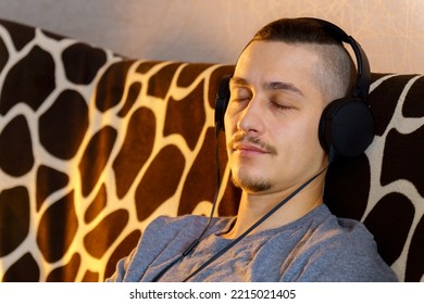 Man Listens To Music. Rest And Relax Concept, Listening To Music, Audiobook, Podcast, Enjoying Meditation. Selective Focus