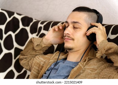 Man Listens To Music. Rest And Relax Concept, Listening To Music, Audiobook, Podcast, Enjoying Meditation. Selective Focus