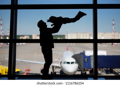 Man With Little Boy Having Fun At The International Airport. Father With His Cute Little Son Waiting Boarding. Family Travel Or Immigration Concept