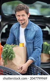 Man Loading Groceries Into His Car