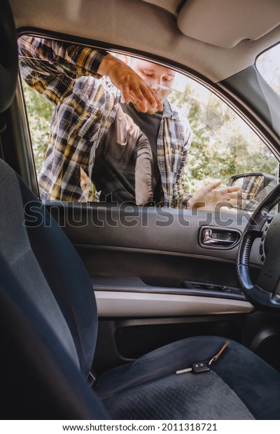 man locked\
car and forget keys inside. copy\
space